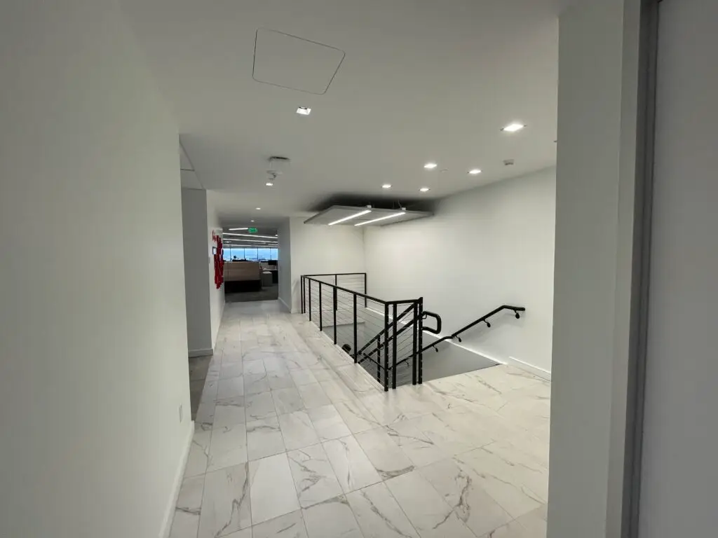 stair-cut-through-office-expansion-denver-class-A-office-building.webp